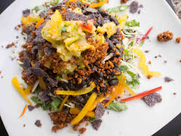 Cheesy Kale Chips top off Pesto Quinoa with cashew cheese and a gorgeous marinated tomato & yellow squash marriage.