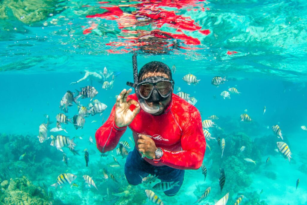 A man enjoying Grand Cayman Snorkeling.