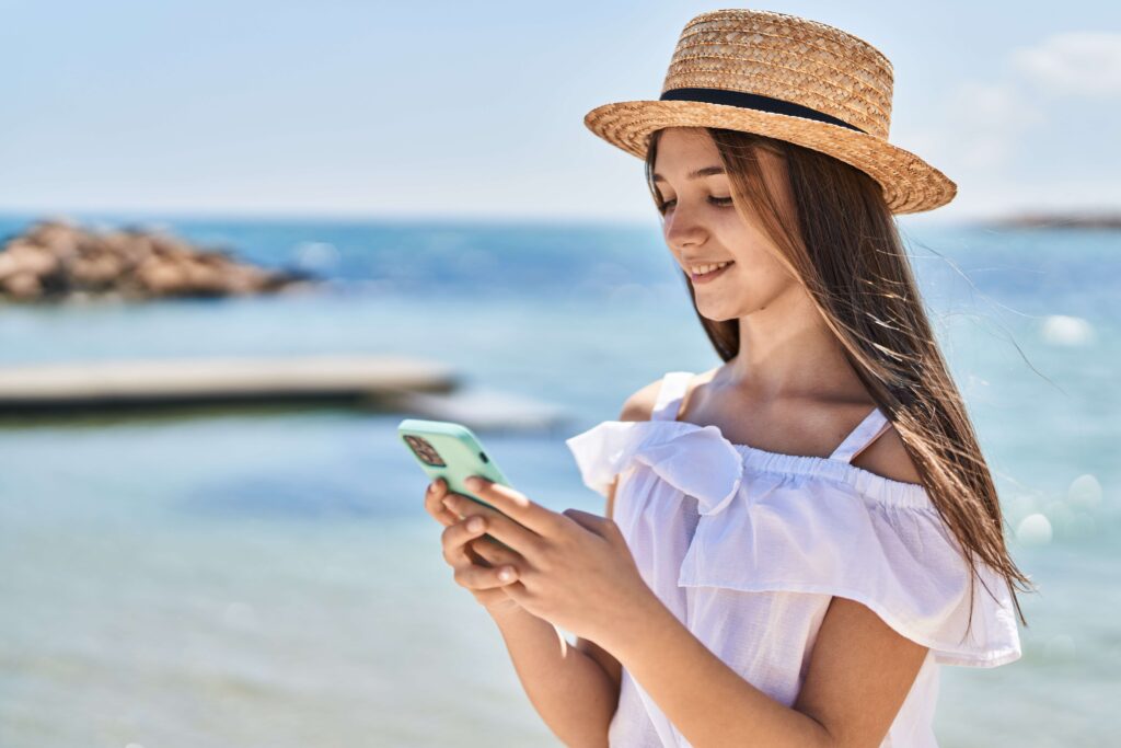 A person checking the Best Travel Apps on Grand Cayman.
