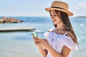 A person checking the Best Travel Apps on Grand Cayman.